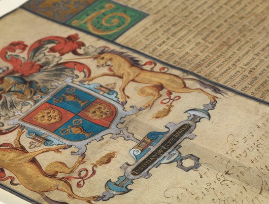 Close-up of a coat of arms with historical text and symbols