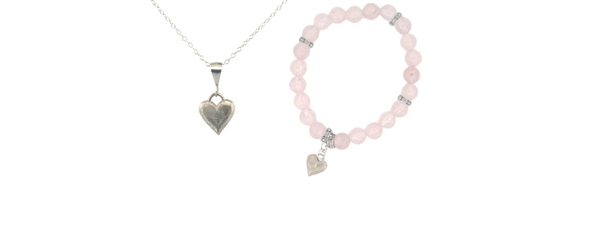 Necklace and bracelet with heart-shaped charms on a white background