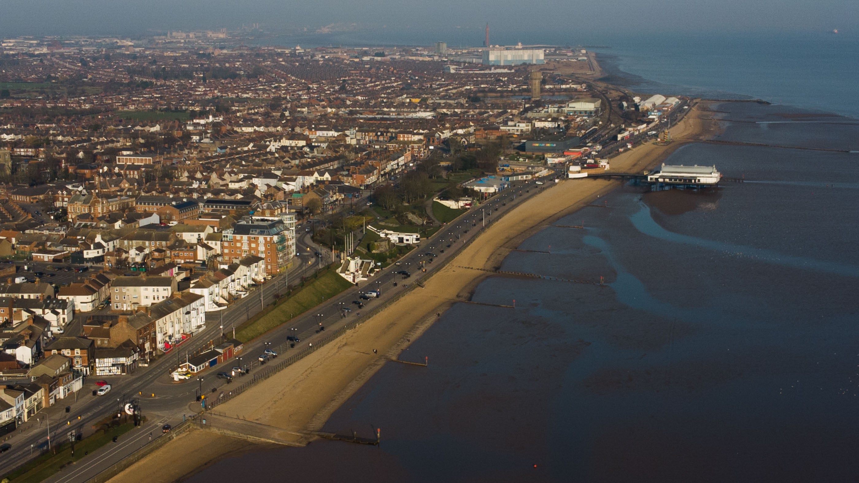 Aerial view of a Cleethorpes with a beach and waterfront.
